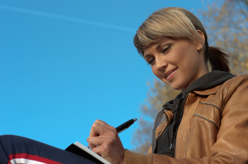 Lady Writing Outdoors